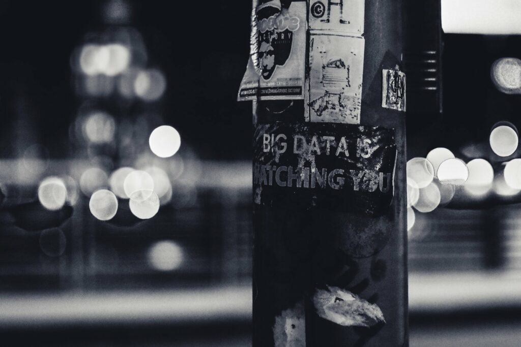 Power pole with sticker saying Big Data is watching you.